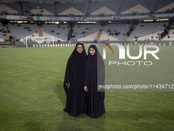 Two veiled clergywomen from Thailand and Azerbaijan, who are living and studying at the Jamiat al-Zahra International seminary school in the...