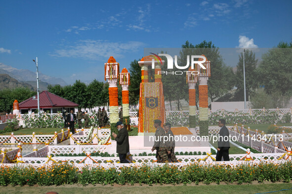 Indian Prime Minister Narendra Modi (C) and senior Army officers are being seen at a war memorial during the ''Vijay Diwas'' or Victory Day...