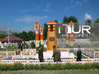 Indian Prime Minister Narendra Modi (C) and senior Army officers are being seen at a war memorial during the ''Vijay Diwas'' or Victory Day...