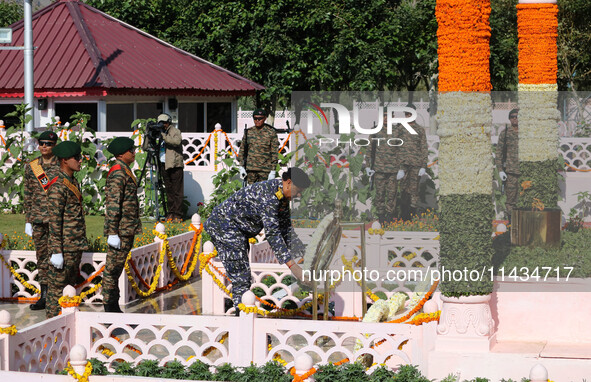 Indian Navy Chief Admiral Dinesh K Tripathi PVSM is laying a wreath at a war memorial during ''Vijay Diwas'' or Victory Day celebration in D...