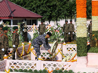 Indian Navy Chief Admiral Dinesh K Tripathi PVSM is laying a wreath at a war memorial during ''Vijay Diwas'' or Victory Day celebration in D...