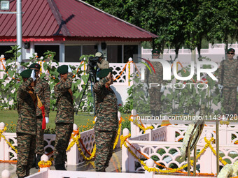 Indian Army Chief Upendra Dwivedi is saluting to pay tribute at a war memorial during the ''Vijay Diwas'' or Victory Day celebration in Dras...