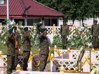 Indian Army Chief Upendra Dwivedi is saluting to pay tribute at a war memorial during the ''Vijay Diwas'' or Victory Day celebration in Dras...