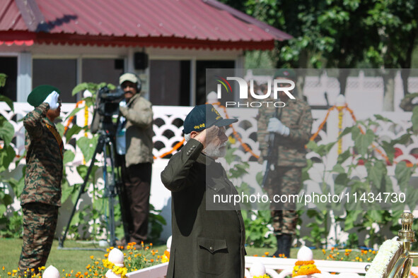 Indian Prime Minister Narendra Modi is saluting as he pays tribute at a war memorial during the ''Vijay Diwas'' or Victory Day celebration i...