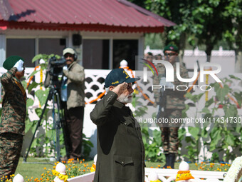 Indian Prime Minister Narendra Modi is saluting as he pays tribute at a war memorial during the ''Vijay Diwas'' or Victory Day celebration i...