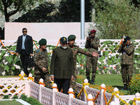 Indian Prime Minister Narendra Modi (C) and senior Army officers are being seen at a war memorial during the ''Vijay Diwas'' or Victory Day...