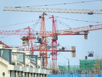 Tower cranes are being seen at a real estate construction site in Yantai, Shandong province, China, on July 23, 2024. On July 15, 2024, the...