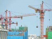 Tower cranes are being seen at a real estate construction site in Yantai, Shandong province, China, on July 23, 2024. On July 15, 2024, the...