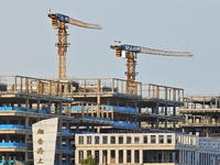 Tower cranes are being seen at a real estate construction site in Yantai, Shandong province, China, on July 23, 2024. On July 15, 2024, the...