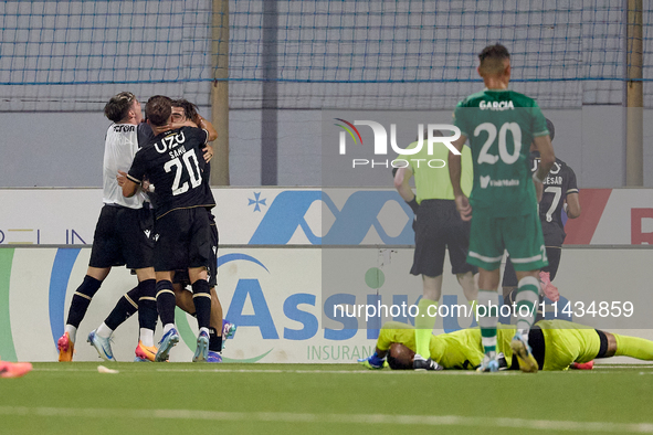 Silva Joao Pedro Ferreira (3rd L, partially hidden) of Vitoria SC is being congratulated by his teammates after scoring the 0-1 goal during...