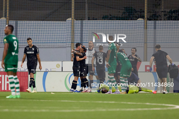 Silva Joao Pedro Ferreira (2nd R) of Vitoria SC is being congratulated by his teammates after scoring the 0-1 goal during the UEFA Europa Co...