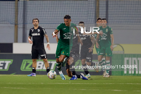 Matias Garcia (front left) of Floriana is being closely challenged by Tomas Handel (front right, partially hidden) of Vitoria SC during the...