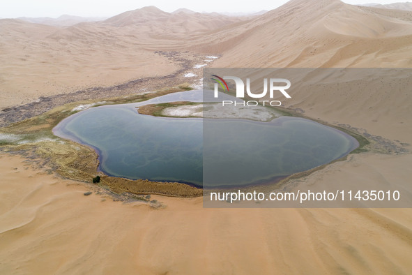 A view of Ma Lake, deep in the Badain Jaran Desert, in Inner Mongolia, China, on May 2, 2020. On July 26, 2024, at the 46th session of the U...