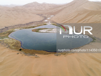 A view of Ma Lake, deep in the Badain Jaran Desert, in Inner Mongolia, China, on May 2, 2020. On July 26, 2024, at the 46th session of the U...