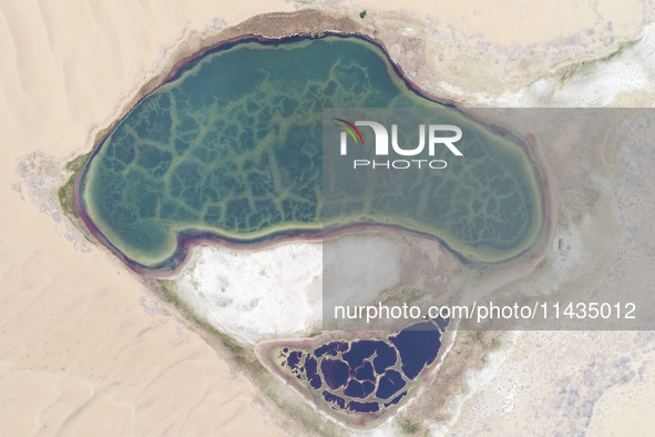 A view of Ma Lake, deep in the Badain Jaran Desert, in Inner Mongolia, China, on May 2, 2020. On July 26, 2024, at the 46th session of the U...