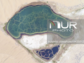 A view of Ma Lake, deep in the Badain Jaran Desert, in Inner Mongolia, China, on May 2, 2020. On July 26, 2024, at the 46th session of the U...