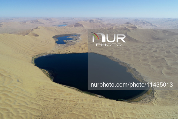 A view of Nanhaizi Lake, deep in the Badain Jaran Desert, in Inner Mongolia, China, on May 9, 2020. On July 26, 2024, at the 46th session of...