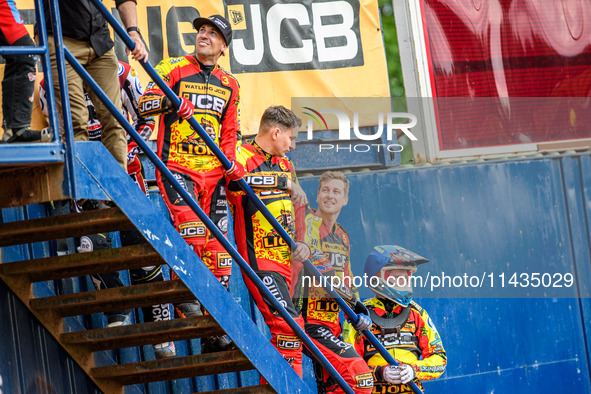 (Left to Right): Leicester Lions' riders Sam Masters, Craig Cook, Ryan Douglas, and Sam Hagon are standing on the steps to watch the first h...