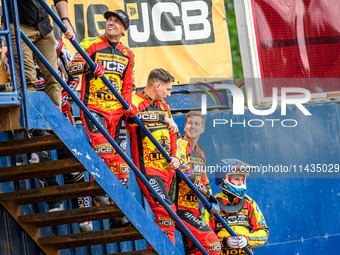 (Left to Right): Leicester Lions' riders Sam Masters, Craig Cook, Ryan Douglas, and Sam Hagon are standing on the steps to watch the first h...