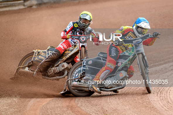 Leicester Lions' Richard Lawson in Blue is leading Belle Vue Aces' Norick Blodorn in Yellow during the Rowe Motor Oil Premiership match betw...