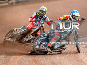 Leicester Lions' Richard Lawson in Blue is leading Belle Vue Aces' Norick Blodorn in Yellow during the Rowe Motor Oil Premiership match betw...