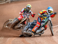 Leicester Lions' Richard Lawson in Blue is leading Belle Vue Aces' Norick Blodorn in Yellow during the Rowe Motor Oil Premiership match betw...