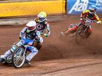 Belle Vue Aces' Antti Vuolas in white and teammate Jake Mulford in yellow are leading Leicester Lions' Sam Hagon in blue during the Rowe Mot...