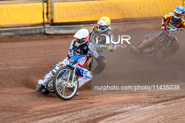 Belle Vue Aces' Antti Vuolas in white and teammate Jake Mulford in yellow are leading Leicester Lions' Sam Hagon in blue during the Rowe Mot...