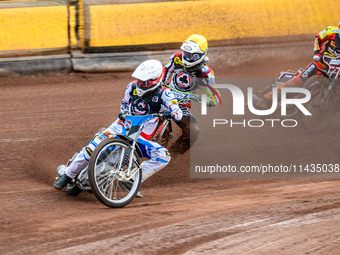 Belle Vue Aces' Antti Vuolas in white and teammate Jake Mulford in yellow are leading Leicester Lions' Sam Hagon in blue during the Rowe Mot...