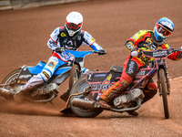 Leicester Lions' Sam Hagon in blue is leading Belle Vue Aces' Antti Vuolas in white during the Rowe Motor Oil Premiership match between Leic...