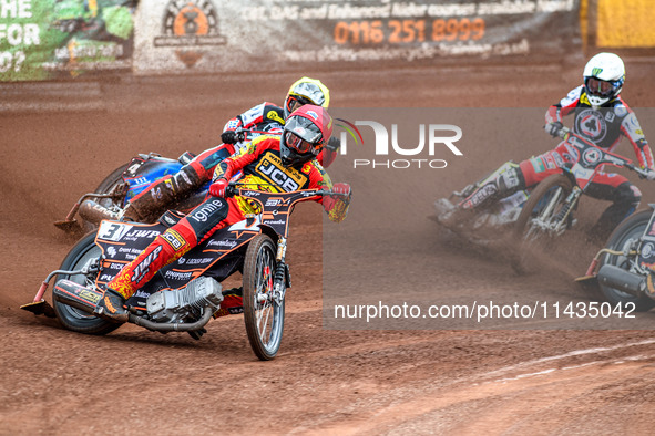 Leicester Lions' Sam Masters in Red is leading Belle Vue Aces' Ben Cook in Yellow and Belle Vue Aces' Jaimon Lidsey in White during the Rowe...