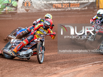 Leicester Lions' Sam Masters in Red is leading Belle Vue Aces' Ben Cook in Yellow and Belle Vue Aces' Jaimon Lidsey in White during the Rowe...