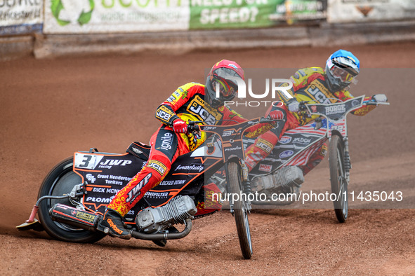 Leicester Lions' Sam Masters in red is leading teammate Luke Becker in blue during the Rowe Motor Oil Premiership match between Leicester Li...