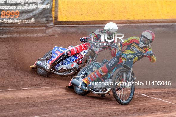 Leicester Lions' Ryan Douglas in Red is leading Belle Vue Aces' Dan Bewley in White during the Rowe Motor Oil Premiership match between Leic...