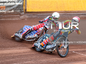 Leicester Lions' Ryan Douglas in Red is leading Belle Vue Aces' Dan Bewley in White during the Rowe Motor Oil Premiership match between Leic...