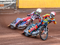 Leicester Lions' Ryan Douglas in Red is leading Belle Vue Aces' Dan Bewley in White during the Rowe Motor Oil Premiership match between Leic...