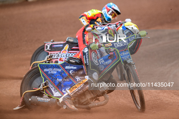 Belle Vue Aces' Jake Mulford in Yellow is leading Leicester Lions' Sam Hagon in Blue during the Rowe Motor Oil Premiership match between Lei...