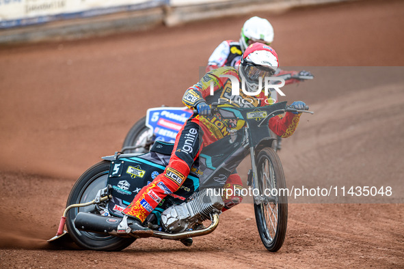 Leicester Lions' Ryan Douglas in Red is leading Belle Vue Aces' Dan Bewley in White during the Rowe Motor Oil Premiership match between Leic...