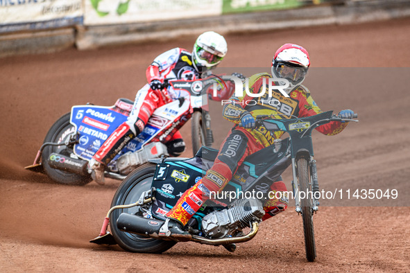 Leicester Lions' Ryan Douglas in Red is leading Belle Vue Aces' Dan Bewley in White during the Rowe Motor Oil Premiership match between Leic...