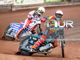 Leicester Lions' Ryan Douglas in Red is leading Belle Vue Aces' Dan Bewley in White during the Rowe Motor Oil Premiership match between Leic...