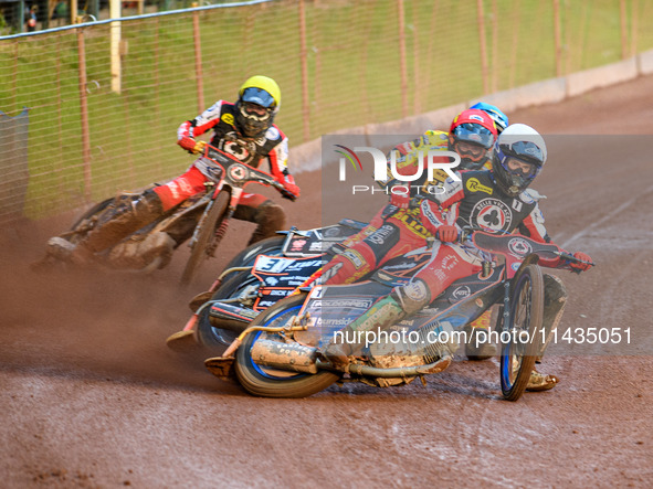 Belle Vue Aces' Brady Kurtz in White is leading Leicester Lions' Sam Masters in Red, Leicester Lions' Luke Becker in Blue, and Belle Vue Ace...