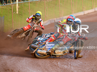 Belle Vue Aces' Brady Kurtz in White is leading Leicester Lions' Sam Masters in Red, Leicester Lions' Luke Becker in Blue, and Belle Vue Ace...