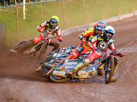 Belle Vue Aces' Brady Kurtz in White is leading Leicester Lions' Sam Masters in Red, Leicester Lions' Luke Becker in Blue, and Belle Vue Ace...