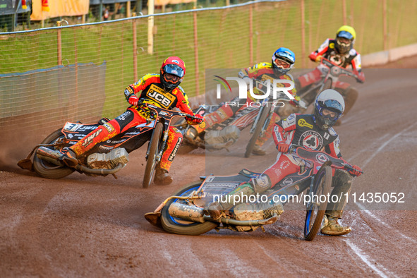 Belle Vue Aces' Brady Kurtz in White is leading Leicester Lions' Sam Masters in Red, Leicester Lions' Luke Becker in Blue, and Belle Vue Ace...