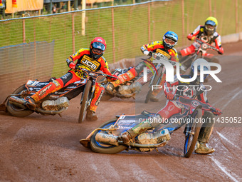 Belle Vue Aces' Brady Kurtz in White is leading Leicester Lions' Sam Masters in Red, Leicester Lions' Luke Becker in Blue, and Belle Vue Ace...