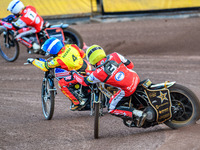 Belle Vue Aces' Norick Blodorn in Yellow is chasing Leicester Lions' Luke Becker in Blue and Belle Vue Aces' Brady Kurtz in White during the...