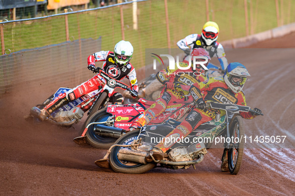 Leicester Lions' Richard Lawson in Blue is leading Leicester Lions' Max Fricke in Red, Belle Vue Aces' Dan Bewley in White, and Belle Vue Ac...