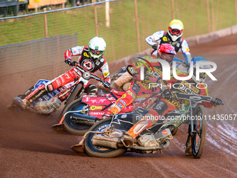 Leicester Lions' Richard Lawson in Blue is leading Leicester Lions' Max Fricke in Red, Belle Vue Aces' Dan Bewley in White, and Belle Vue Ac...