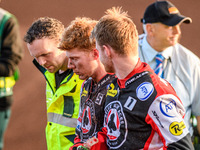 Belle Vue Aces' Dan Bewley (center) is being helped back to the pits after his crash by Belle Vue Aces' Brady Kurtz (right) and the paramedi...