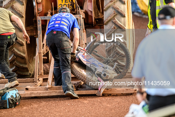 Belle Vue Aces' Dan Bewley's damaged bike is being taken back to the pits after the crash during the Rowe Motor Oil Premiership match betwee...